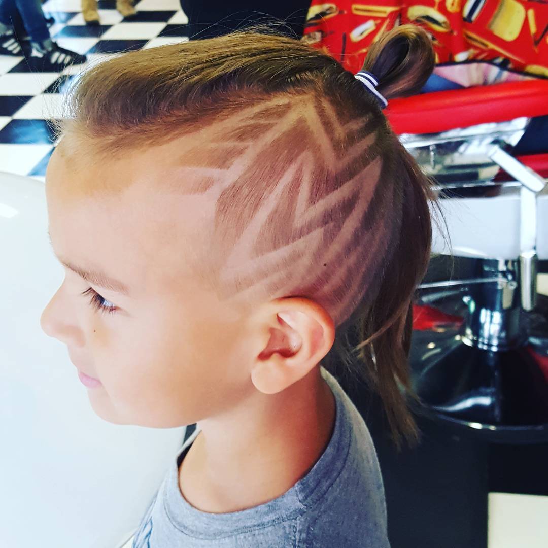 Caleigh gave this little man a wicked design.  #grandopening #barber #toronto #barbernation #yongestreet #haircut #5carlton #shave #collegettc